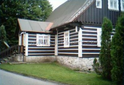 Část roubené chalupy Harrachov